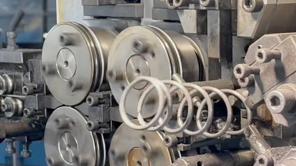 CNC spring forming machine coiling a compression spring at AOFENG SPRING (THAILAND)